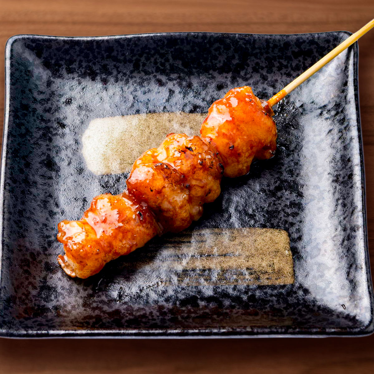 牛ホルモン串（味噌・辛口）